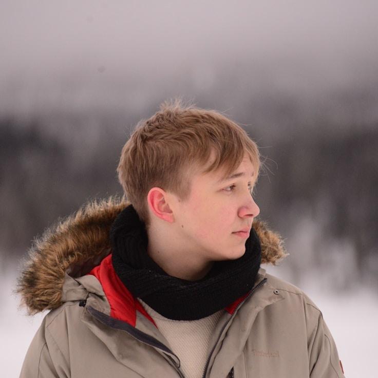 Kaveri Mehta, Lead Design Curator at CedarHarborMeadow, reviewing corporate floral arrangements